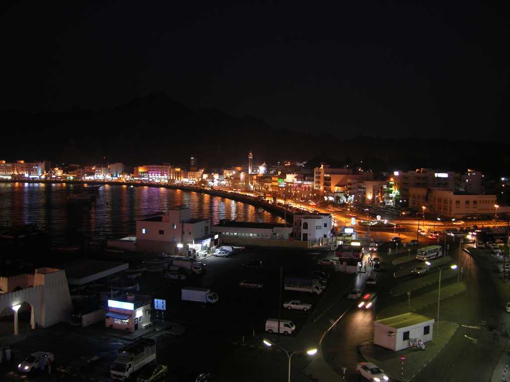 Muscat 03 Mutrah 13 Corniche After Sunset Here is a great view of the Mutrah corniche at night from the Al-Boom Restaurant in the Marina Hotel at the western end of the corniche.